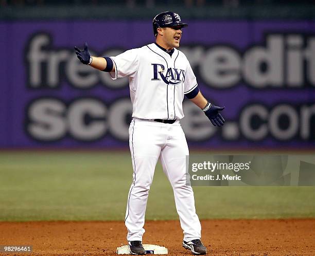 Pinch hitter Kelly Shoppach of the Tampa Bay Rays doubles in the tying run against the Baltimore Orioles during the home opener game at Tropicana...