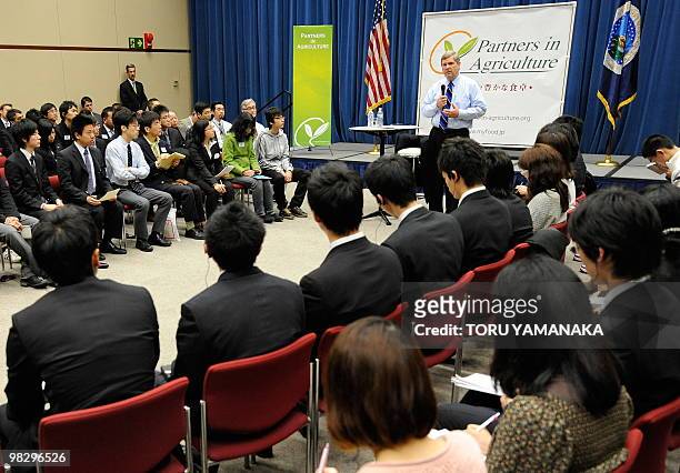 Secretary of Agriculture Tom Vilsack gestures as he answers a question during a town hall meeting with Japanese university students from throughout...