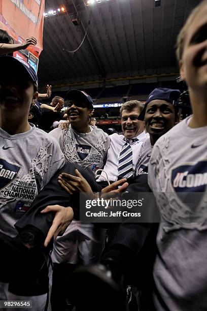 Connecticut Huskies head coach Geno Auriemma is carried to the locker room by his team following their 53-47 win over the Stanford Cardinal during...