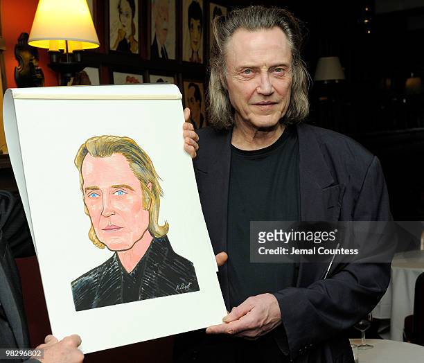 Actor Christopher Walken holds his caricature during an unveiling ceremony to unveil the Christopher Walken caricature at Sardi's on April 6, 2010 in...