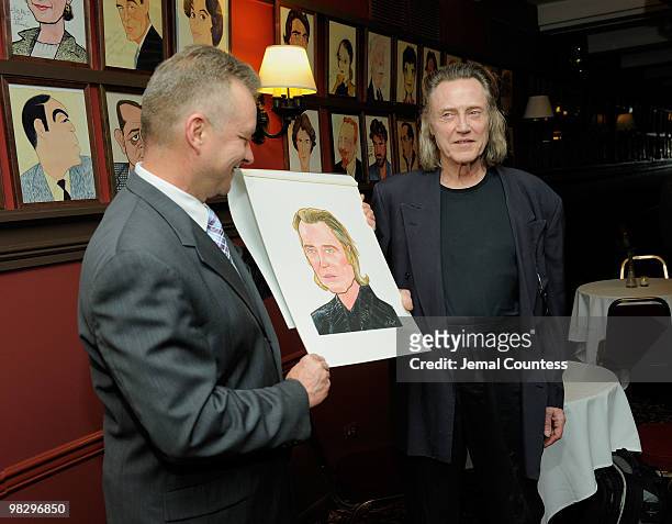Max Klimavicius, Manager of the historic Sardis Restaurant presents actor Christopher Walken with his caricature during an unveiling ceremony to...