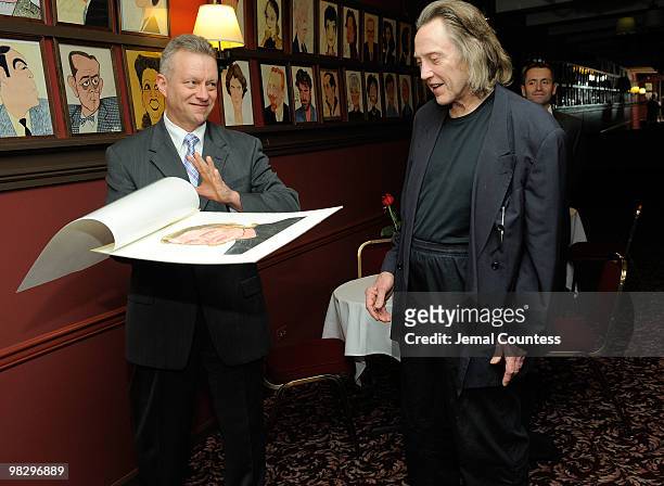 Max Klimavicius, Manager of the historic Sardis Restaurant presents actor Christopher Walken with his caricature during an unveiling ceremony to...