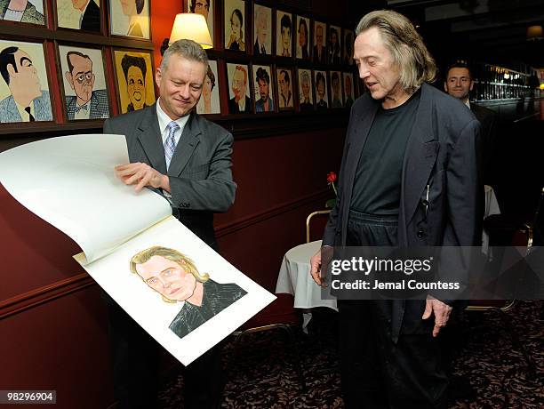 Max Klimavicius, Manager of the historic Sardis Restaurant presents actor Christopher Walken with his caricature during an unveiling ceremony to...