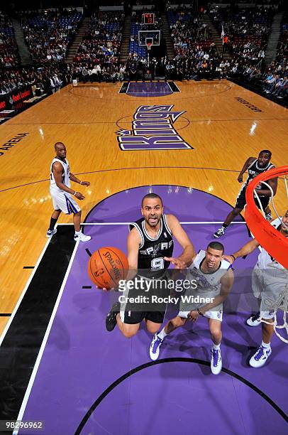 Tony Parker of the San Antonio Spurs gets to the basket against Francisco Garcia of the Sacramento Kings on April 6, 2010 at ARCO Arena in...