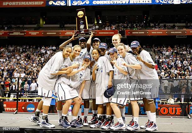 The Connecticut Huskies celebrate with the national championship trophy after a 53-47 win against the Stanford Cardinal during the NCAA Women's Final...