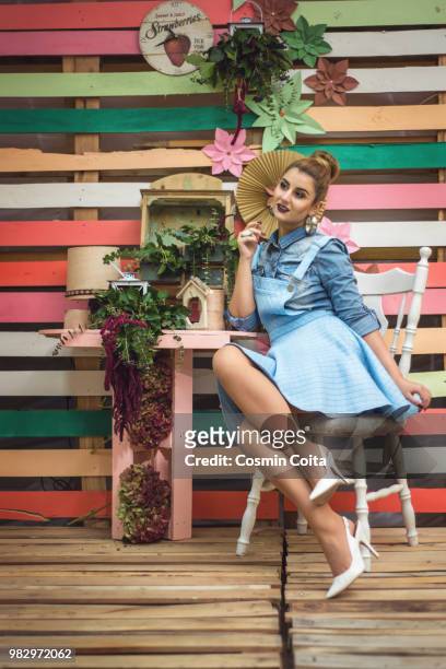 colorful decor studio shot of fashion woman. vivid colors. rainbow colors painted on wood. vintage o - fashion studio shot stock pictures, royalty-free photos & images