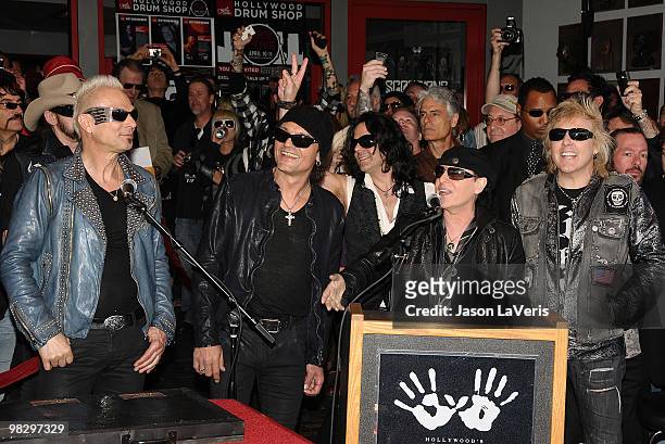 Rudolf Schenker, Matthias Jabs, Pawel Maciwoda, Klaus Meine and James Kottak The Scorpions are inducted into the Hollywood RockWalk on April 6, 2010...