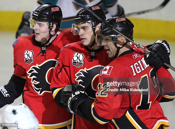 Rene Bourque of the Calgary Flames celebrates his goal with teammates Jarome Iginla and Matt Stajan against the San Jose Sharks in the third period...