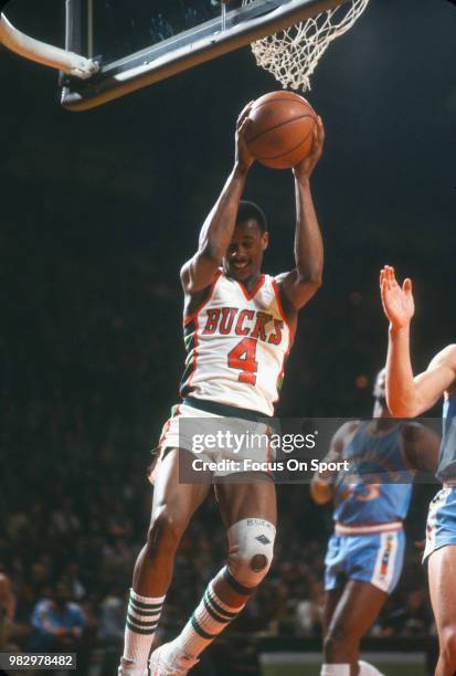 Sidney Moncrief of the Milwaukee Bucks grabs a rebound against the San Diego Clippers during an NBA basketball game circa 1980 at the MECCA Arena in...