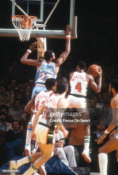 Sidney Moncrief of the Milwaukee Bucks grabs a rebound away from Marvin Barnes of the San Diego Clippers during an NBA basketball game circa 1980 at...