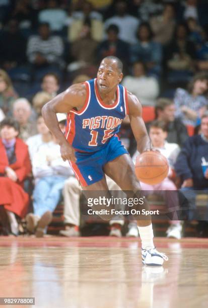 Vinnie Johnson of the Detroit Pistons dribbles the ball against the New York Knicks during an NBA basketball game circa 1990 at Madison Square Garden...