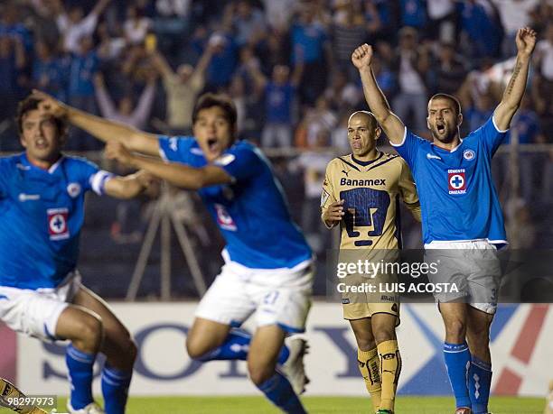 Cruz Azul's Christian Riveros Emanuel Villa and Javier Orozco celebrate after scoring against Pumas during their Concachampions Cup semifinal match,...