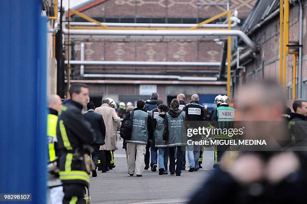 Policemen and firemen workon April 07, 2010 in Gennevilliers outside Paris, in the factory where a fire and an explosion killed one person and...