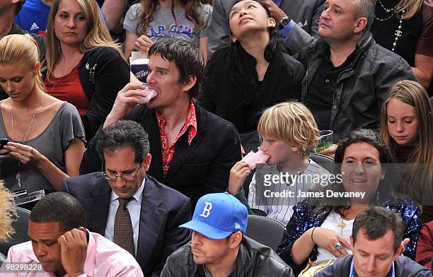 Ethan Hawke and son Levon Roan Hawke attend a game between the Boston Celtics and the New York Knicks at Madison Square Garden on April 6, 2010 in...