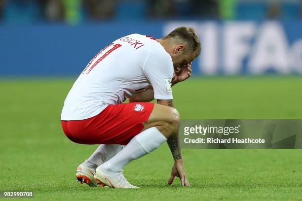 Kamil Grosicki of Poland looks dejected following his sides defeat in the 2018 FIFA World Cup Russia group H match between Poland and Colombia at...