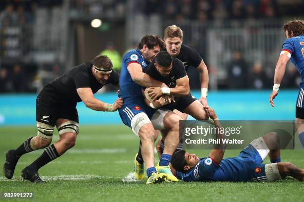 Richie Mo'unga of the New Zealand All Blacks is tackled during the International Test match between the New Zealand All Blacks and France at Forsyth...