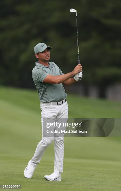 Jason Day of Australia watches his second shot on the third hole during the final round of the Travelers Championship at TPC River Highlands on June...