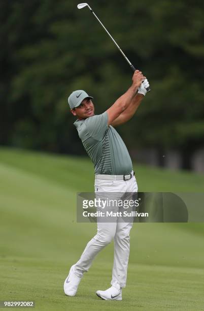 Jason Day of Australia watches his second shot on the third hole during the final round of the Travelers Championship at TPC River Highlands on June...