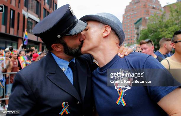 Revellers kiss during the annual Pride Parade on June 24, 2018 in New York City. The first gay pride parade in the U.S. Was held in Central Park on...