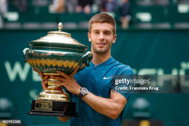 Tennis player Borna Coric of Croatia holds the trophy during the Gerry Weber Open 2018 at Gerry Weber Stadium on June 24, 2018 in Halle, Germany.