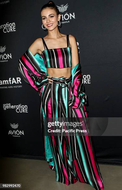 Victoria Justice wearing dress by Victoria Hayes attends amfAR GenerationCure Solstice 2018 at SECOND.