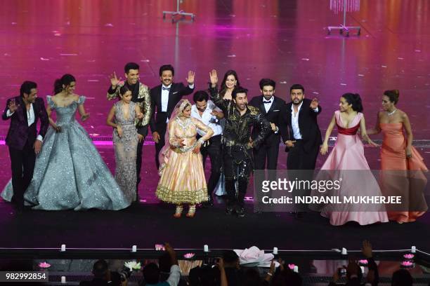 Bollywood actress Rekha performs with other actors and actresses at the closing of the IIFA Awards of the 19th International Indian Film Academy...