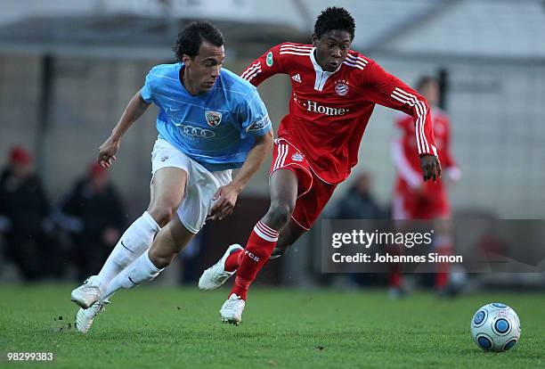 David Alaba of Bayern and Moise Bambara of Ingolstadt fight vor the ball during the 3rd League match FC Bayern Muenchen II vs FC Ingolstadt at...