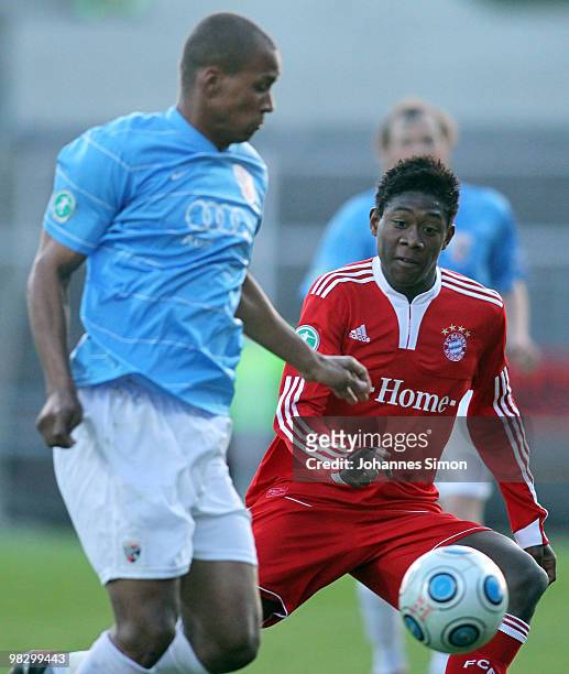 David Alaba of Bayern and David Pisot of Ingolstadt fight vor the ball during the 3rd League match FC Bayern Muenchen II vs FC Ingolstadt at...
