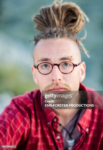 man in his twenties with long blonde dreadlocks - ems forster productions stock pictures, royalty-free photos & images