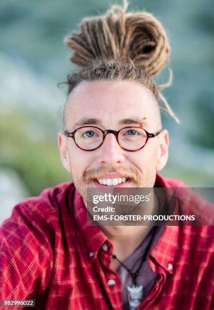 man in his twenties with long blonde dreadlocks - ems forster productions stock pictures, royalty-free photos & images