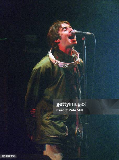 Liam Gallagher of Oasis performs on stage at the Glastonbury Festival on June 23th, 1995 in Somerset, England.