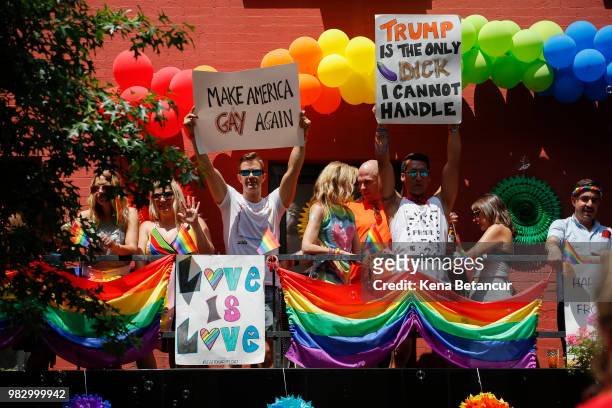 Revellers watch the annual Pride Parade on June 24, 2018 in New York City. The first gay pride parade in the U.S. Was held in Central Park on June...
