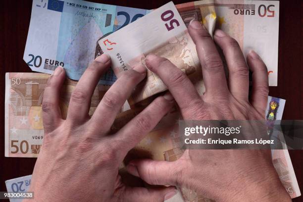 dirty hands and money - bringing home the bacon stock pictures, royalty-free photos & images