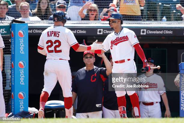 Jason Kipnis of the Cleveland Indians is congratulated by Francisco Lindor after hitting a solo home run in the eighth inning against the Detroit...