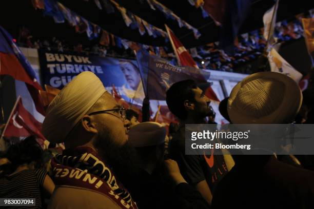 People react to the outcome of the parliamentary and presidential elections outside of the AKP party headquarters in Istanbul, Turkey, on Sunday,...