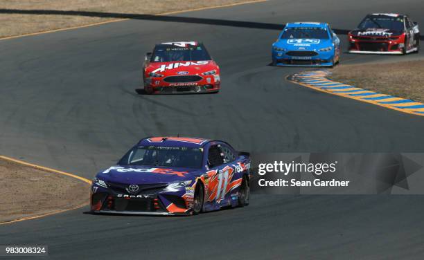 Denny Hamlin, driver of the FedEx Express Toyota, races during the Monster Energy NASCAR Cup Series Toyota/Save Mart 350 at Sonoma Raceway on June...