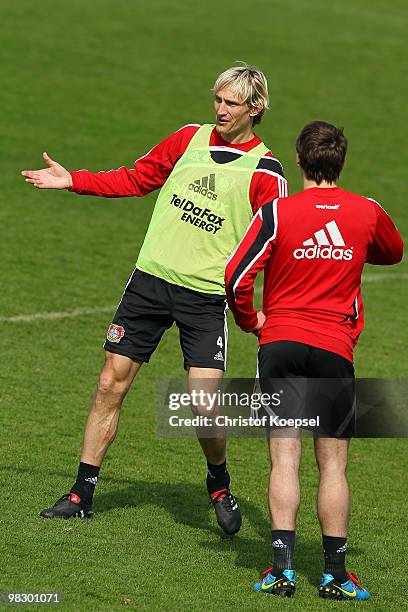 Sami Hyypiae of Leverkusen talks to Patrick Helmes during the training session of Bayer Leverkusen at the training ground on April 7, 2010 in...