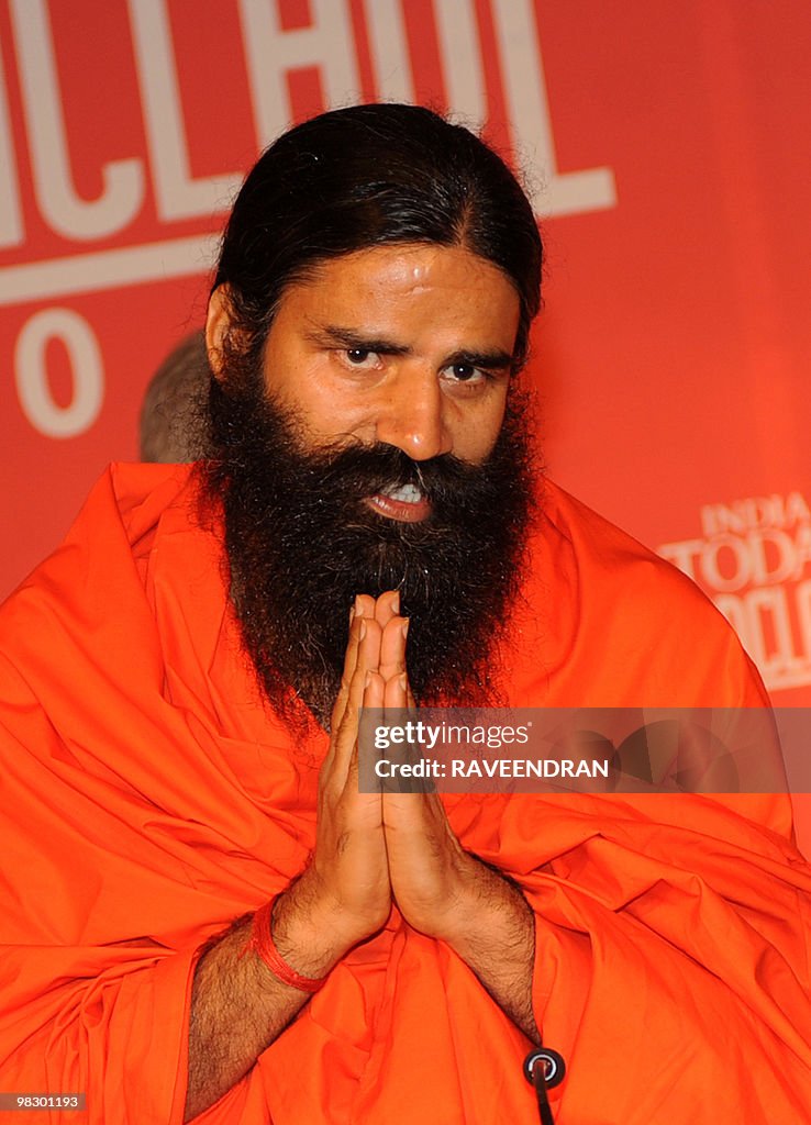 Ramdev Indian yoga guru Swami Ramdev gestures as he addresses delegates ...