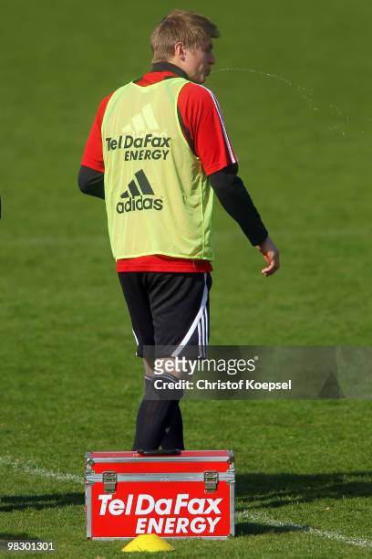 Toni Kroos of Leverkusen spitts during the training session of Bayer Leverkusen at the training ground on April 7, 2010 in Leverkusen, Germany.