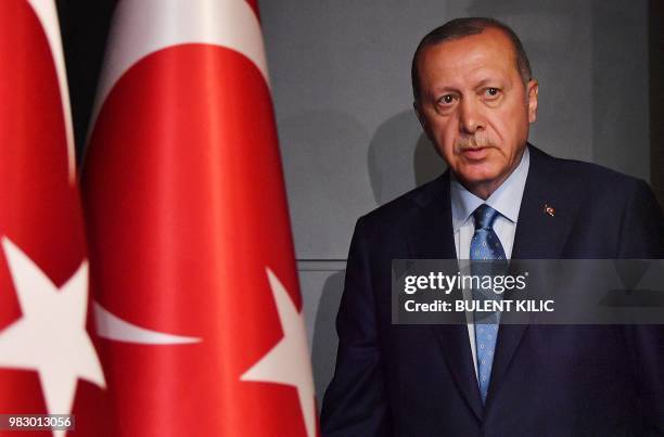 Turkish President Recep Tayyip Erdogan arrives to deliver a speech on June 24, 2018 in Istanbul, after initial results of Turkey's presidential and...