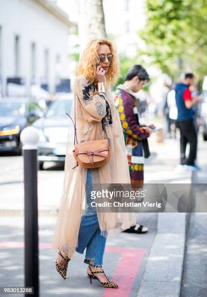 Elina Halimi wearing Loewe bag is seen outside Lanvin on day six of Paris Fashion Week Menswear SS19 on June 24, 2018 in Paris, France.