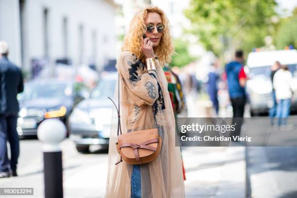 Elina Halimi wearing Loewe bag is seen outside Lanvin on day six of Paris Fashion Week Menswear SS19 on June 24, 2018 in Paris, France.