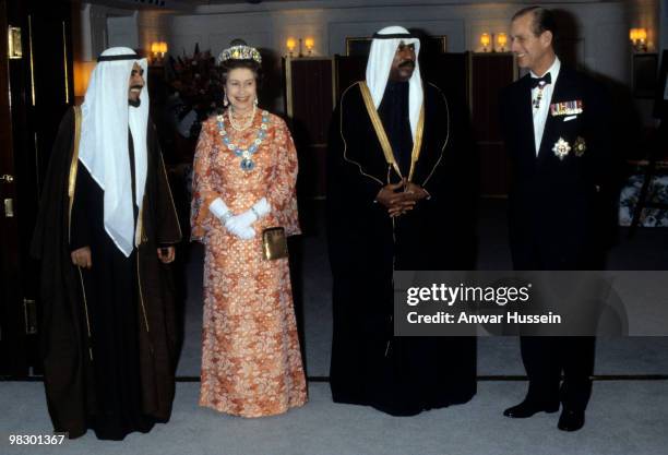 Jaber Al-Ahmad Al-Sabah, the Emir of Kuwait , Queen Elizabeth II, Saad Al-Salim Al-Sabah, of Kuwait, and Prince Philip during a reception on board...