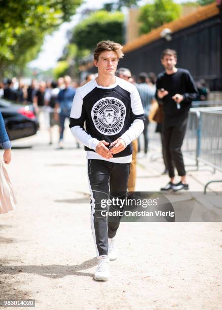 Oliver Cheshire is seen outside Balmain on day six of Paris Fashion Week Menswear SS19 on June 24, 2018 in Paris, France.