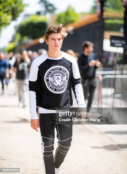 Oliver Cheshire is seen outside Balmain on day six of Paris Fashion Week Menswear SS19 on June 24, 2018 in Paris, France.