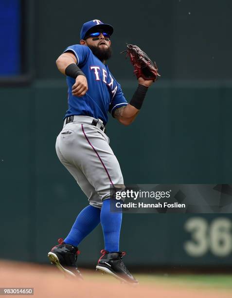 Rougned Odor of the Texas Rangers makes a catches a ball off the bat of Joe Mauer of the Minnesota Twins at second base during the third inning of...