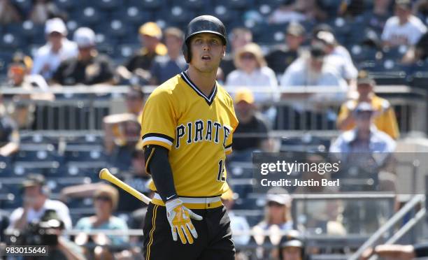 Corey Dickerson of the Pittsburgh Pirates walks back to the dugout after striking out in the seventh inning during the game against the Arizona...