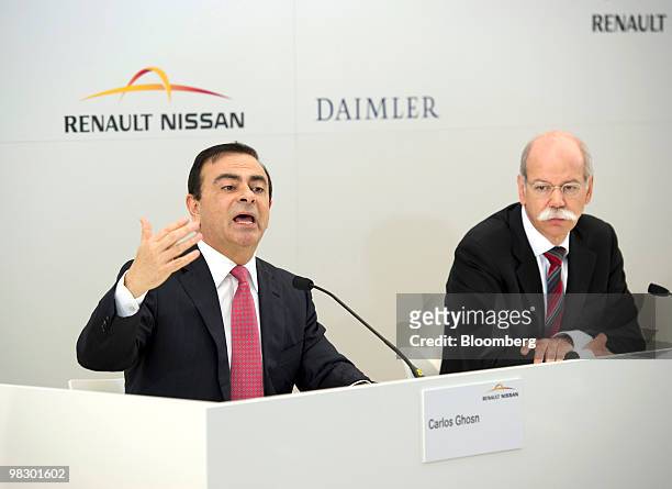 Carlos Ghosn, chief executive officer of Renault SA, left, speaks as Dieter Zetsche, chief executive officer of Daimler AG, listens during their...