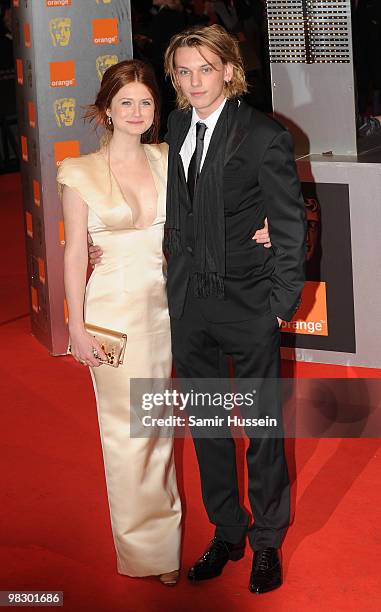 Bonnie Wright and Jamie Campbell Bower arrive at the Orange British Academy Film Awards 2010 at the Royal Opera House on February 21, 2010 in London,...