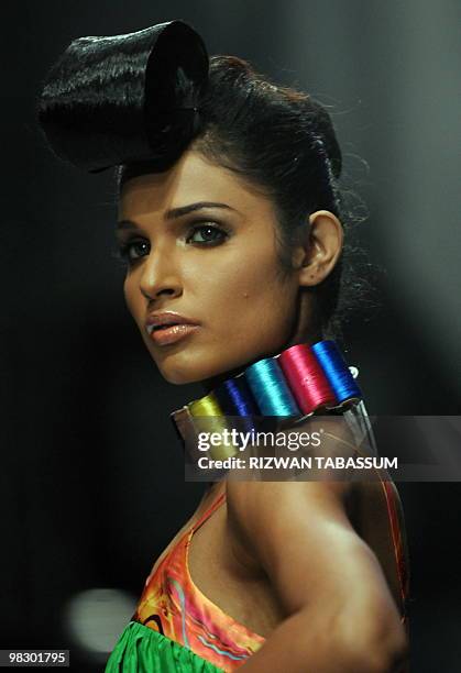 Pakistani model presents a creation by Javed Khan during a Fashion Week in Karachi on April 6, 2010. The event is scheduled to feature 52 designers...